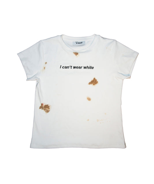 White baby tee with "I Can't Wear White" artwork and intentional stains.